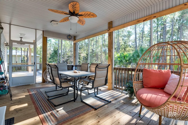 sunroom featuring ceiling fan