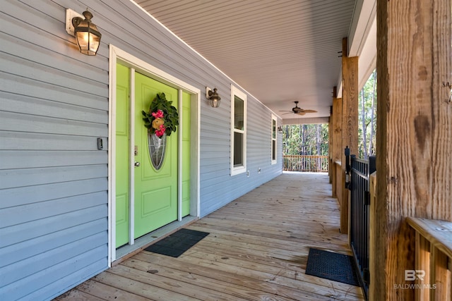 deck with a porch and ceiling fan