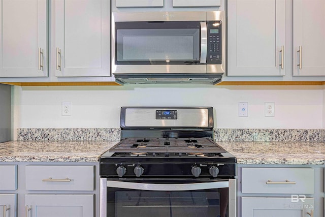 394 Haise Ln, Gulf Shores, AL 36542 - kitchen featuring appliances with stainless steel finishes and light stone countertops