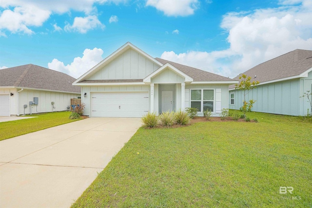 394 Haise Ln, Gulf Shores, AL 36542 - ranch-style home with board and batten siding, an attached garage, concrete driveway, and a front lawn