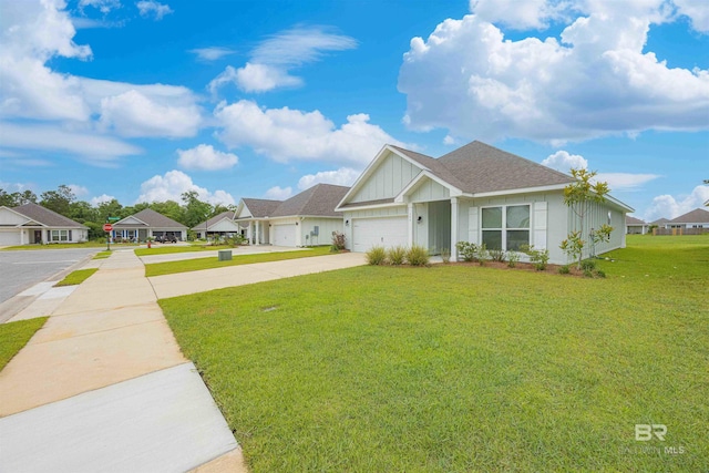 394 Haise Ln, Gulf Shores, AL 36542 - view of front of property featuring driveway, a front yard, board and batten siding, a garage, and a residential view