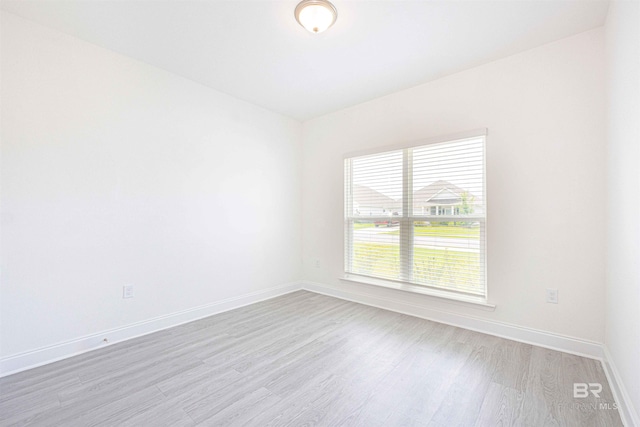 394 Haise Ln, Gulf Shores, AL 36542 - unfurnished room with light wood-style flooring and baseboards