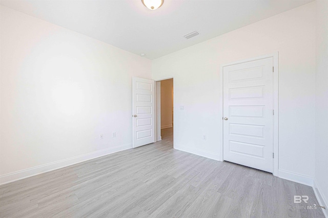 394 Haise Ln, Gulf Shores, AL 36542 - empty room with light wood finished floors and baseboards
