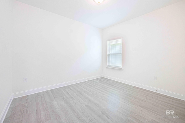 394 Haise Ln, Gulf Shores, AL 36542 - spare room with wood finished floors and baseboards