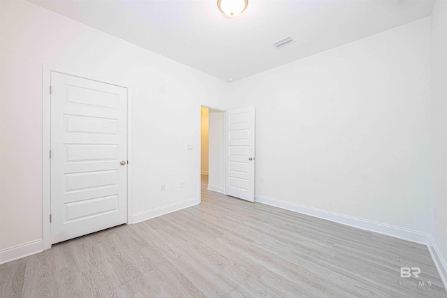 394 Haise Ln, Gulf Shores, AL 36542 - unfurnished bedroom with light wood-style floors and baseboards