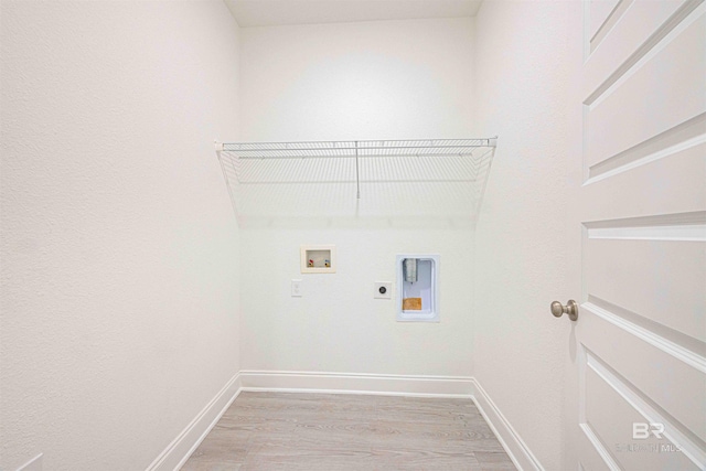 394 Haise Ln, Gulf Shores, AL 36542 - washroom featuring light wood-style floors, electric dryer hookup, baseboards, and washer hookup