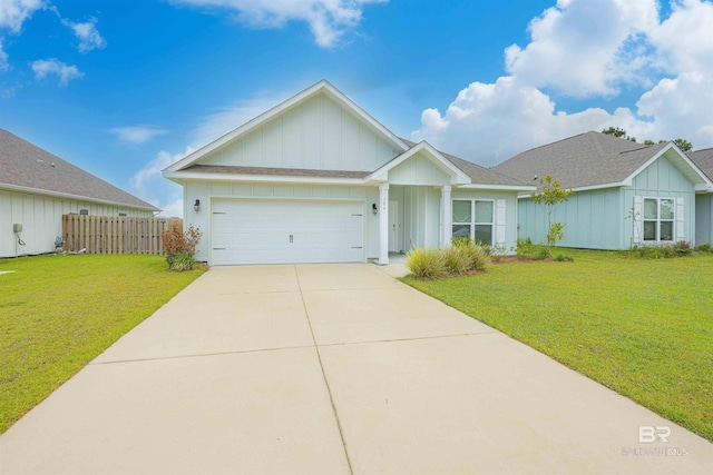 394 Haise Ln, Gulf Shores, AL 36542 - ranch-style house with board and batten siding, concrete driveway, a garage, and roof with shingles