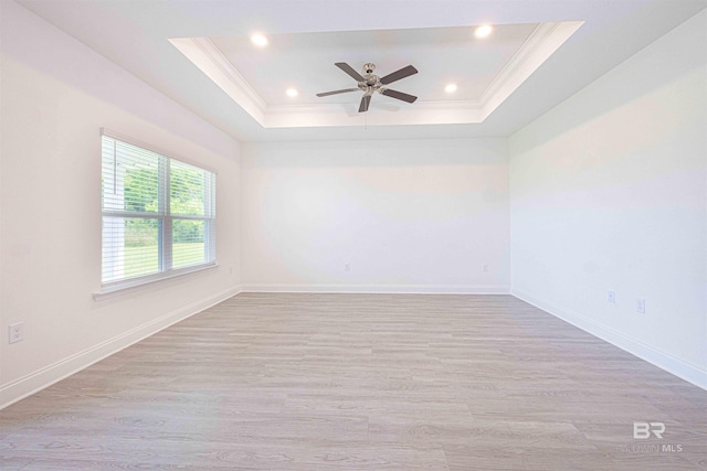 394 Haise Ln, Gulf Shores, AL 36542 - unfurnished room with ornamental molding, a tray ceiling, light wood finished floors, a ceiling fan, and recessed lighting