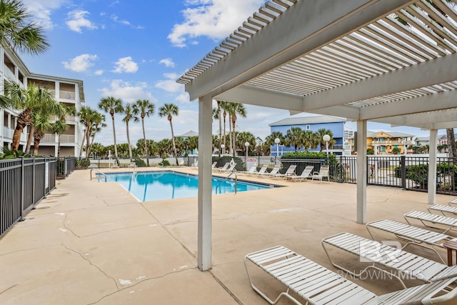 view of swimming pool with a pergola and a patio