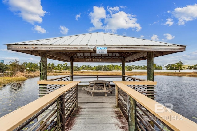 dock area featuring a gazebo and a water view