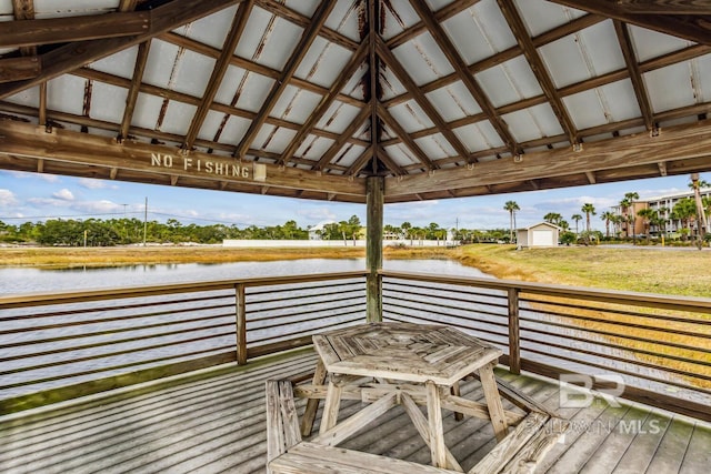 dock area featuring a gazebo and a deck with water view