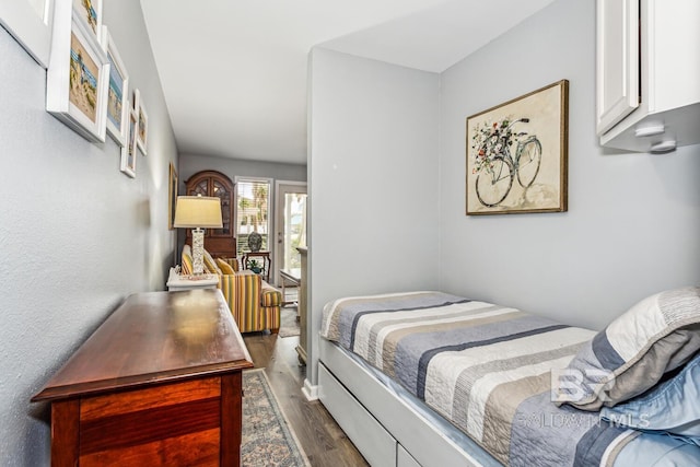 bedroom featuring dark hardwood / wood-style floors