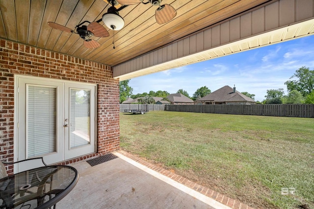 view of patio with a ceiling fan, french doors, and a fenced backyard