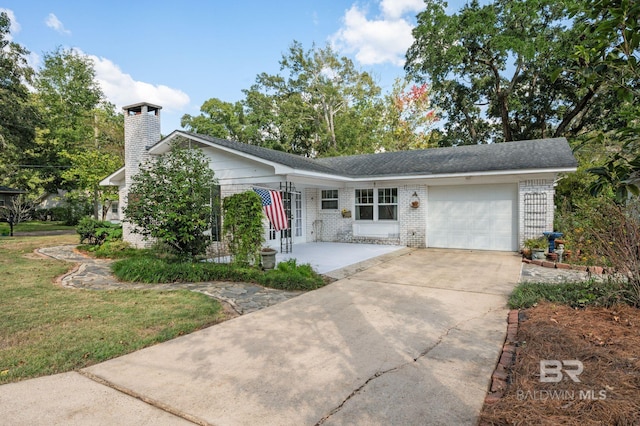 single story home featuring a front yard and a garage