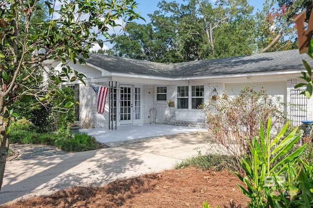 back of property featuring a patio area