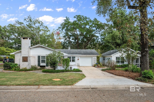 ranch-style home featuring a garage and a front yard