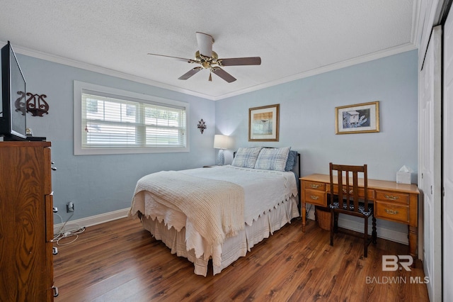 bedroom with a textured ceiling, crown molding, ceiling fan, and dark hardwood / wood-style flooring