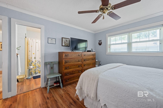 bedroom featuring crown molding, ceiling fan, hardwood / wood-style floors, and a textured ceiling