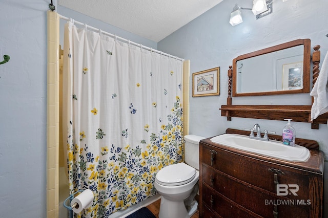 bathroom with vanity, walk in shower, toilet, and a textured ceiling