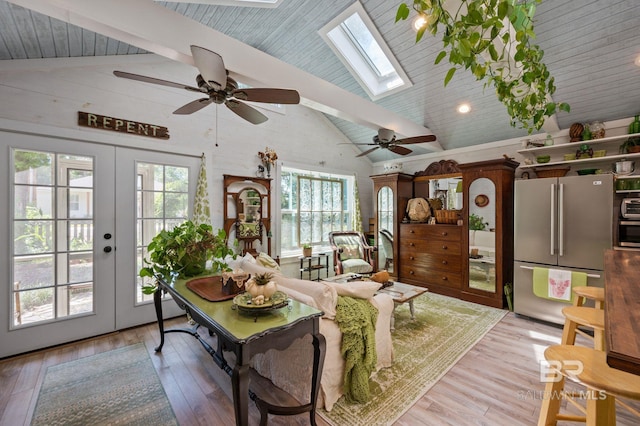 living room featuring high vaulted ceiling, ceiling fan, french doors, light hardwood / wood-style floors, and beam ceiling