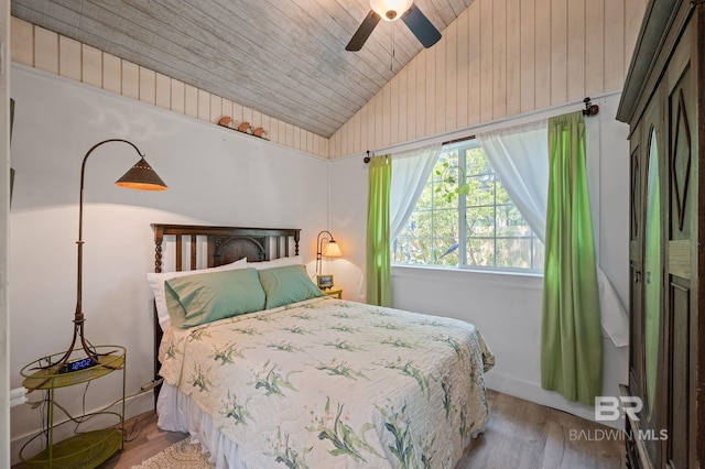 bedroom featuring ceiling fan, vaulted ceiling, wood ceiling, and light hardwood / wood-style flooring