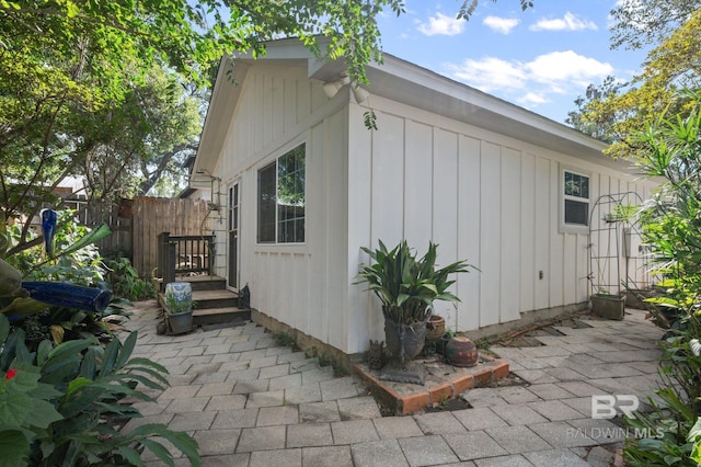 view of side of home with a patio