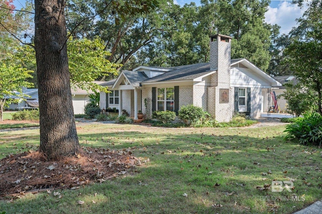 ranch-style house with a front lawn