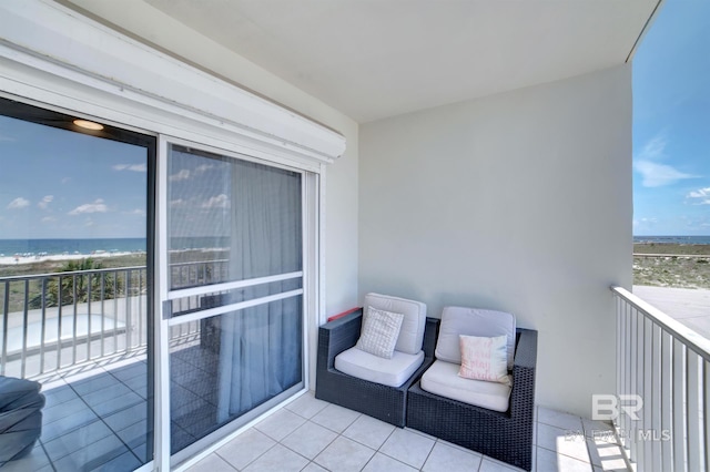 balcony with a view of the beach and a water view