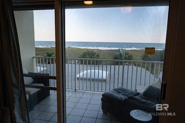 balcony featuring a water view and a view of the beach