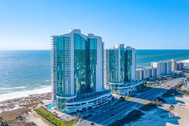 aerial view with a water view, a city view, and a beach view