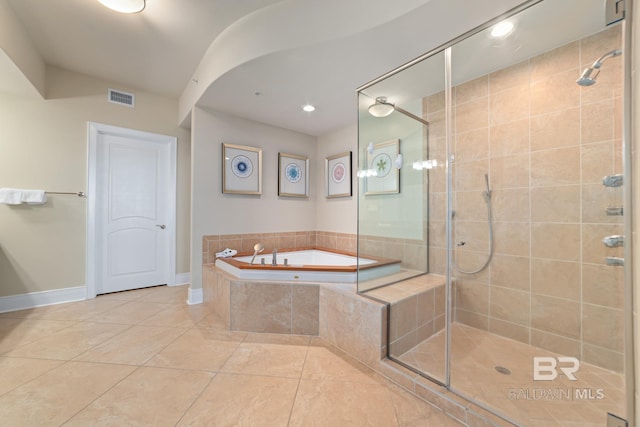 full bathroom featuring visible vents, a garden tub, and a stall shower