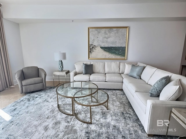 living area featuring baseboards