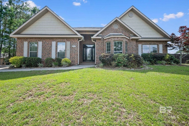 750 Cheswick Ave, Fairhope, AL 36532 - view of front of house featuring a front lawn and brick siding
