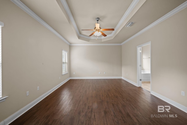 750 Cheswick Ave, Fairhope, AL 36532 - unfurnished room with a raised ceiling, a ceiling fan, crown molding, dark wood-type flooring, and baseboards