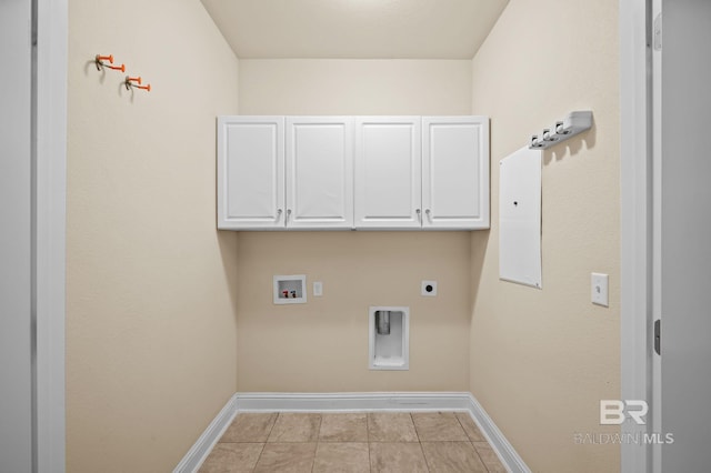 750 Cheswick Ave, Fairhope, AL 36532 - washroom featuring cabinet space, hookup for a washing machine, baseboards, hookup for an electric dryer, and light tile patterned flooring