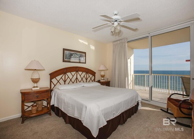 527 Beach Club Trl Unit C1006, Gulf Shores, AL 36542 - carpeted bedroom with ceiling fan, a water view, and access to outside