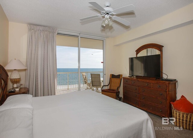 527 Beach Club Trl Unit C1006, Gulf Shores, AL 36542 - carpeted bedroom with a ceiling fan, expansive windows, and access to exterior