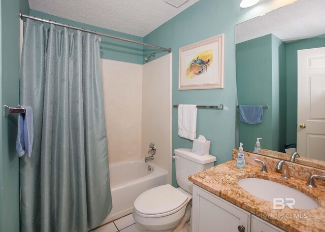 527 Beach Club Trl Unit C1006, Gulf Shores, AL 36542 - full bathroom with a textured ceiling, shower / bath combo with shower curtain, toilet, tile patterned floors, and vanity
