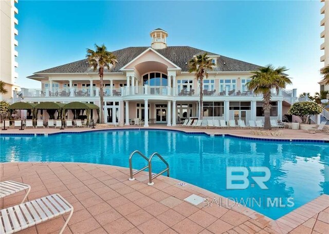 527 Beach Club Trl Unit C1006, Gulf Shores, AL 36542 - pool featuring a patio area