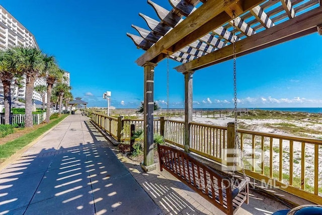 527 Beach Club Trl Unit C1006, Gulf Shores, AL 36542 - exterior space with a pergola, a water view, and a view of the beach