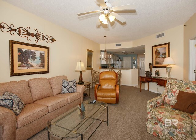 527 Beach Club Trl Unit C1006, Gulf Shores, AL 36542 - carpeted living room with a textured ceiling, visible vents, ceiling fan, and baseboards