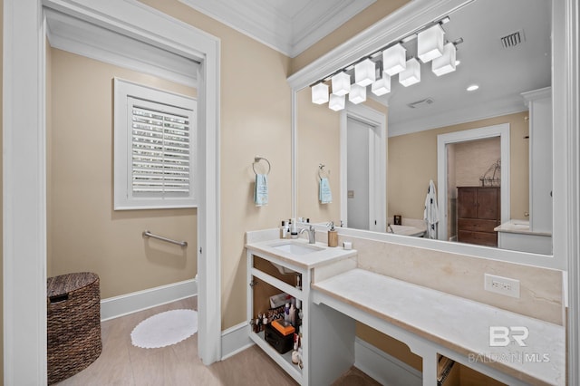 full bathroom with visible vents, vanity, baseboards, and ornamental molding