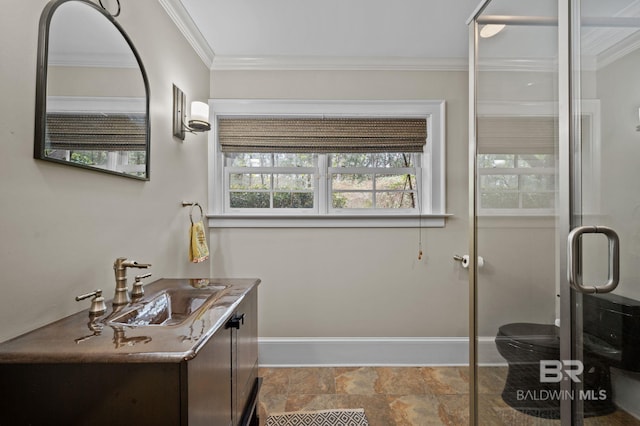 bathroom with a stall shower, vanity, stone finish flooring, and ornamental molding