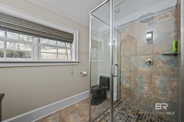 bathroom featuring visible vents, a stall shower, baseboards, and ornamental molding