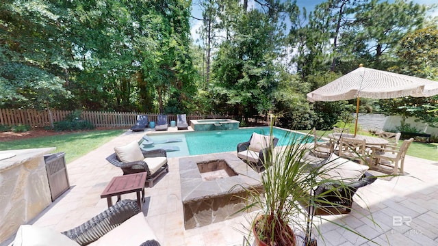 view of swimming pool with a patio and an in ground hot tub