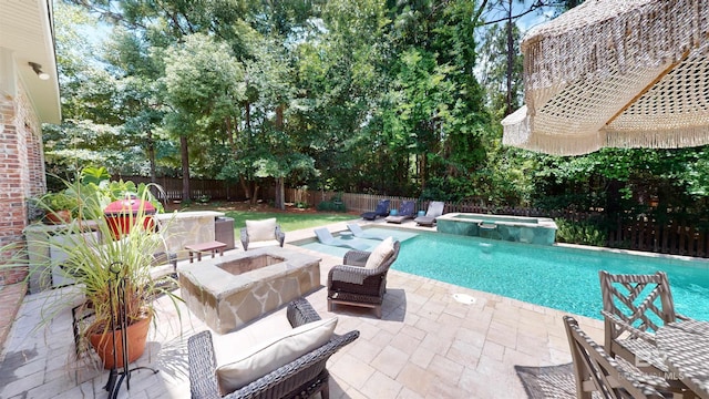 view of pool with a patio and an in ground hot tub