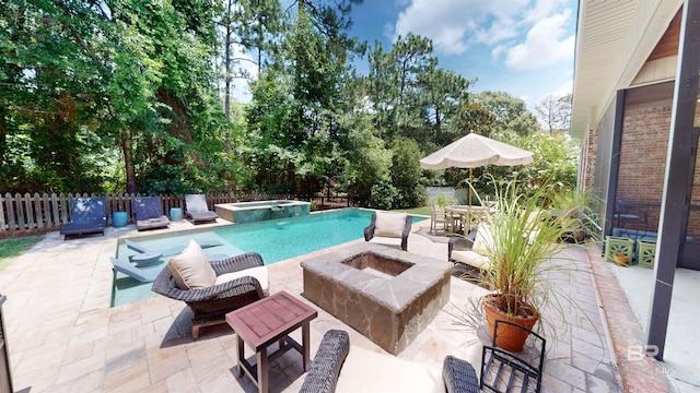 view of swimming pool with a patio and an in ground hot tub