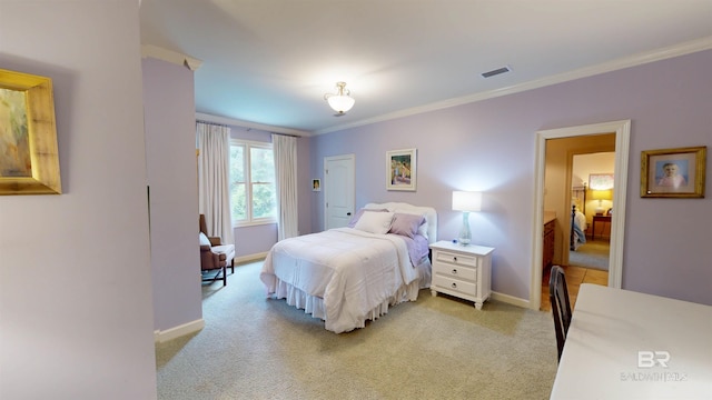 bedroom featuring light colored carpet and ornamental molding