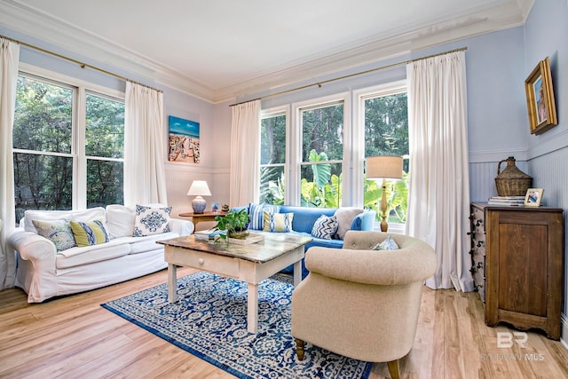 living room featuring light hardwood / wood-style flooring and ornamental molding