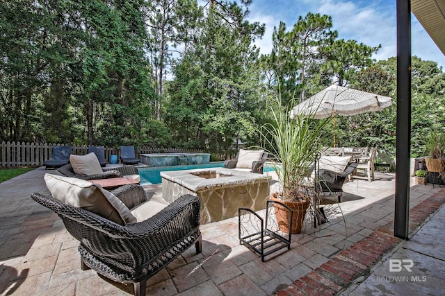 view of patio / terrace with a fenced in pool